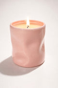 Refillable candle in our pink wavy jar